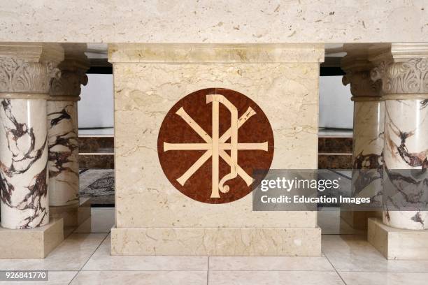 Christian Chi Rho symbol for first two Greek letters of Christ inlaid on the marble altar of a Roman Catholic church in Toronto.