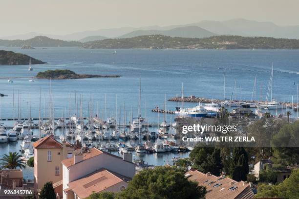 view of rooftops and marina, porquerolles, provence-alpes-cote dazur - porquerolles stock pictures, royalty-free photos & images