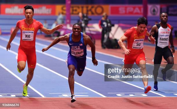 Christian Coleman of United States dips to beat Bingtian Su of China in the 60 Meters Mens Final during the IAAF World Indoor Championships on Day...