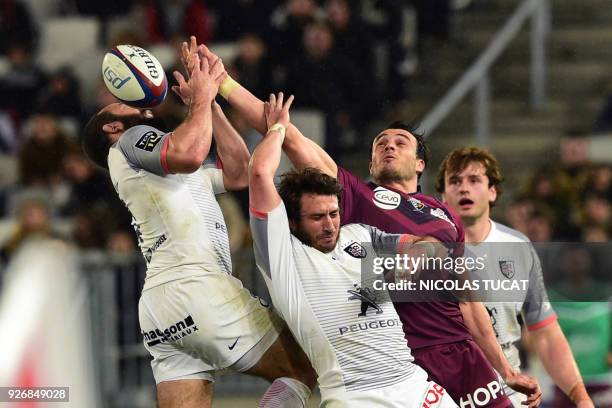 Toulouse's French scrum-half Jean-Marc Doussain and Toulouse's French fullback Maxime Medard vie with Bordeaux-Begles' French fullback Nans Ducuing...