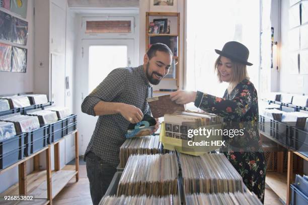 young couple shopping for records together - record store stock pictures, royalty-free photos & images