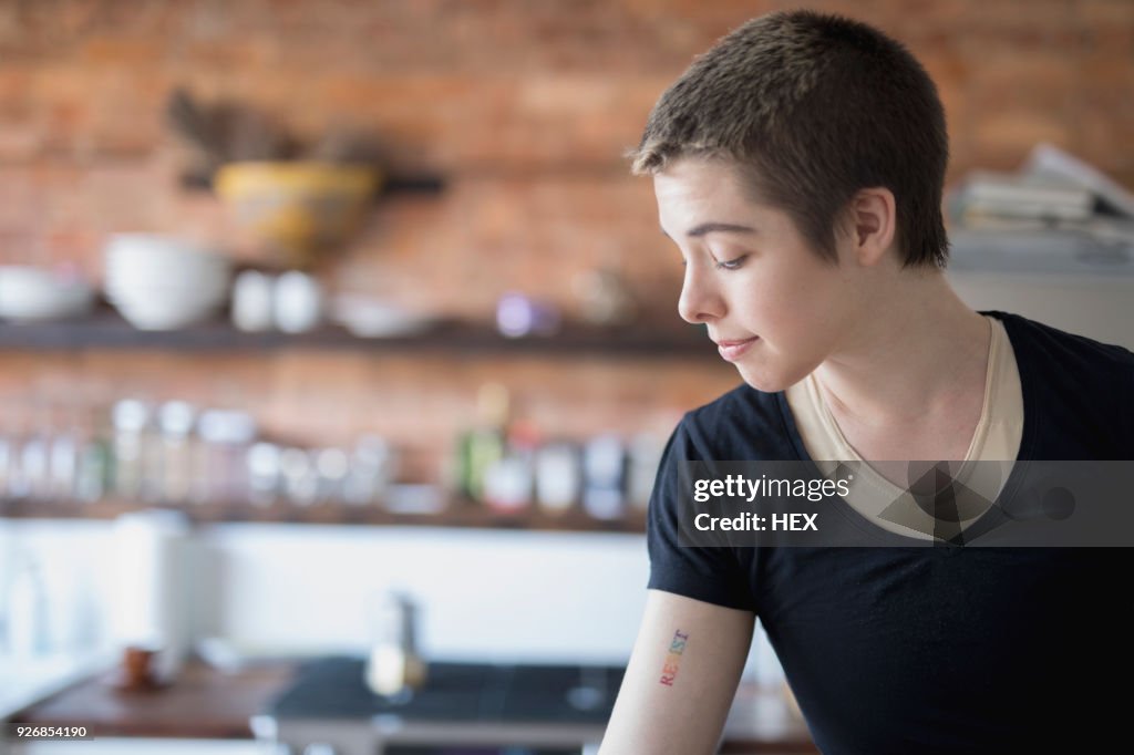 Transgender person with a respect tattoo
