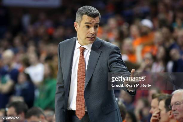 Head coach Tony Bennett of the Virginia Cavaliers calls for a substitution in the first half during a game against the Notre Dame Fighting Irish at...