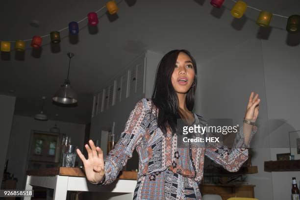 young woman dancing at a party - differential focus fotografías e imágenes de stock