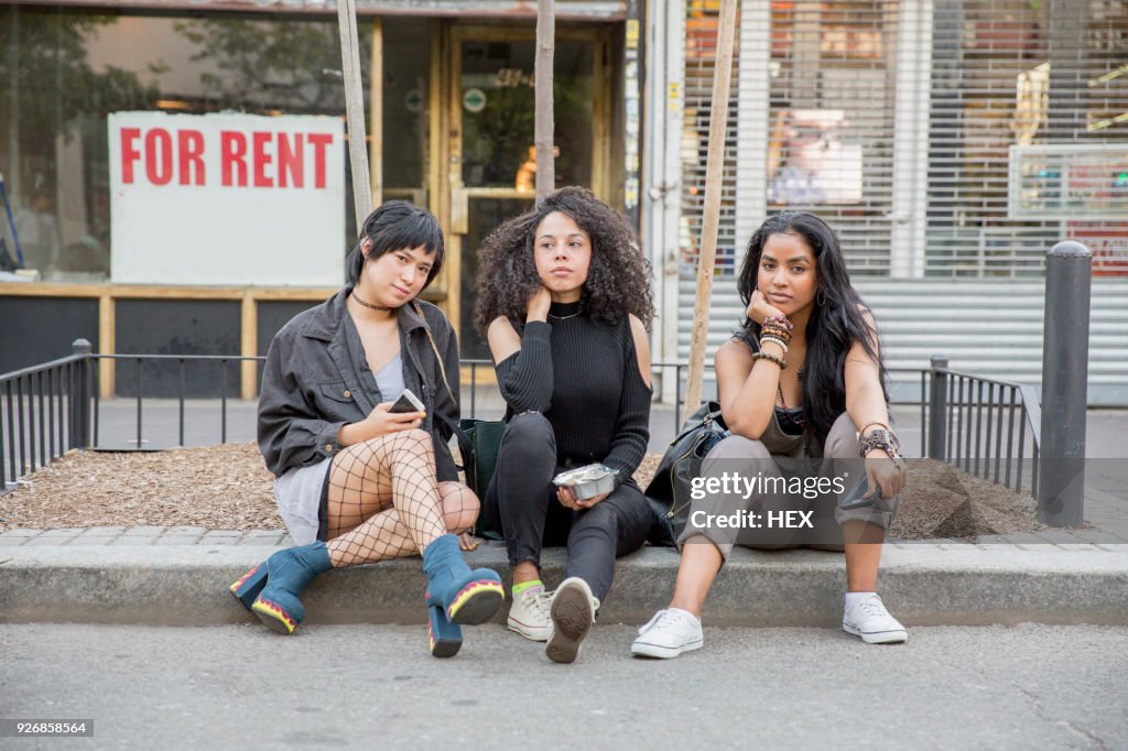 Friends outside a grocery store in Queens, New York