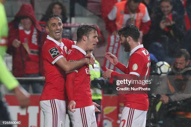 Benfica's Spanish defender Alejandro Grimaldo celebrates after scoring a goal with Benfica's Brazilian forward Jonas and Benfica's Portuguese...