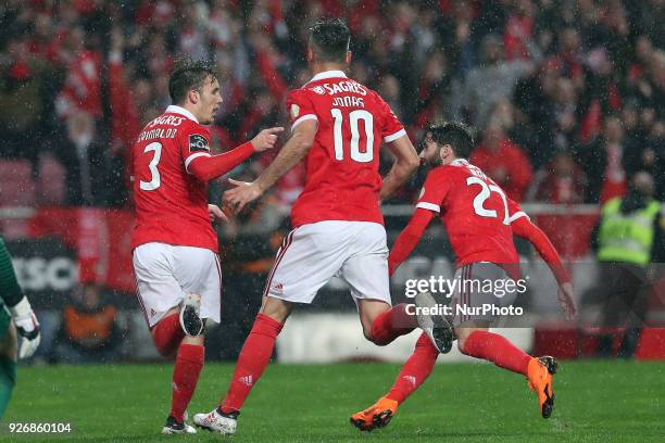 Benfica's Spanish defender Alejandro Grimaldo celebrates after scoring a goal with Benfica's Brazilian forward Jonas and Benfica's Portuguese...