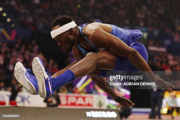 Athlete Will Claye competes in the men's triple jump final at the 2018 IAAF World Indoor Athletics Championships at the Arena in Birmingham on March...
