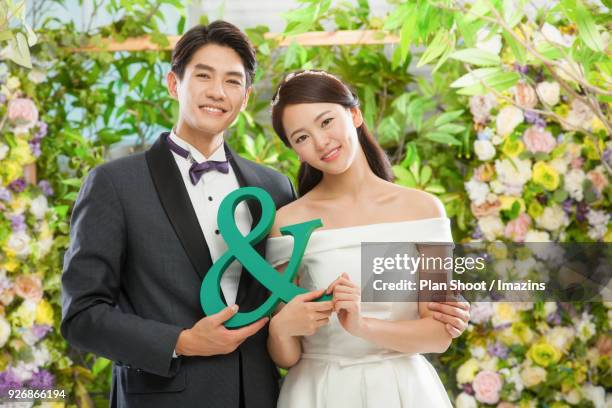 couple holding & symbol - ampersand stock pictures, royalty-free photos & images