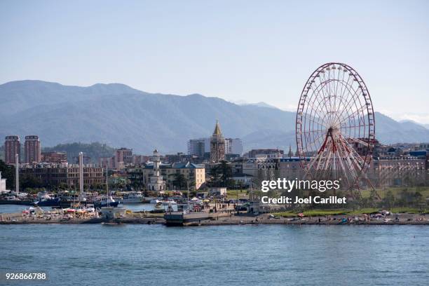 ferris wheel at beach in batumi, georgia - ajaria stock pictures, royalty-free photos & images