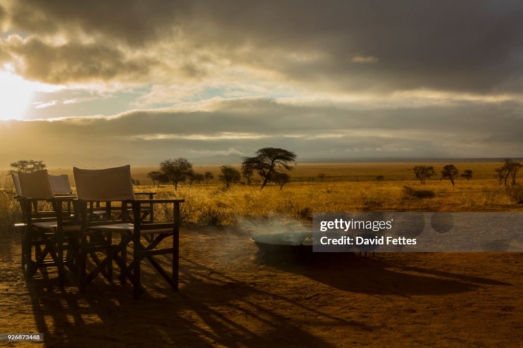 Camp fire and chairs, Tarangire National Park, Tanzania, Africa