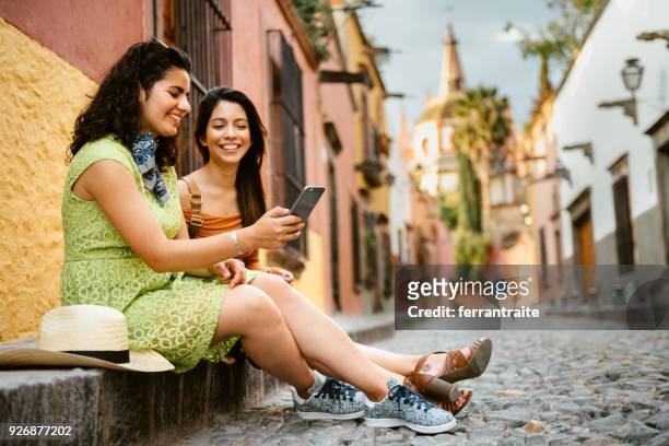 girlfriends traveling mexico - tourist talking on the phone stock pictures, royalty-free photos & images