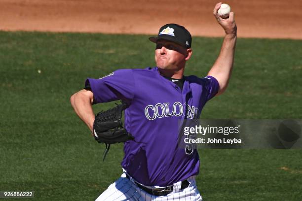 Colorado Rockies relief pitcher Jake McGee delivers a pitch during the fourth inning against the Milwaukee Brewers on March 3, 2018 at Salt River...