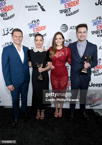 Actors Billy Magnussen, Aubrey Plaza and Elizabeth Olsen and director Matt Spicer pose with the Best First Feature award for 'Ingrid Goes West' in...