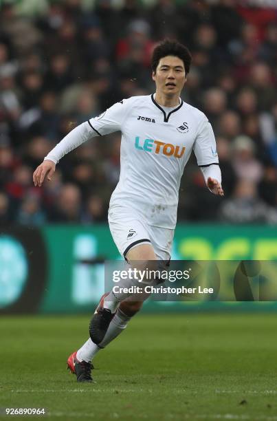 Ki Sung-Yueng of Swansea City in action during the Premier League match between Swansea City and West Ham United at Liberty Stadium on March 3, 2018...