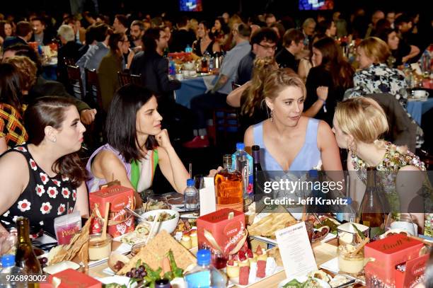 Actor Beanie Feldstein, guest, actor/writer/director Greta Gerwig, and actor Saoirse Ronan with FIJI Water during the 33rd Annual Film Independent...