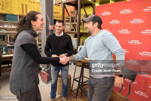 S "Kitchen Cousins" Anthony Carrino and John Colaneri with a customer at the new Cost Plus World Market on March 3, 2018 in Salem, New Hampshire.