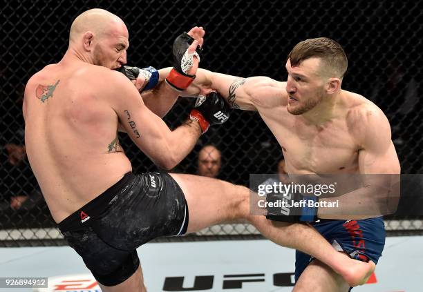 Adam Milstead punches Jordan Johnson in their light heavyweight bout during the UFC 222 event inside T-Mobile Arena on March 3, 2018 in Las Vegas,...