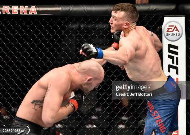 Jordan Johnson punches Adam Milstead in their light heavyweight bout during the UFC 222 event inside T-Mobile Arena on March 3, 2018 in Las Vegas,...