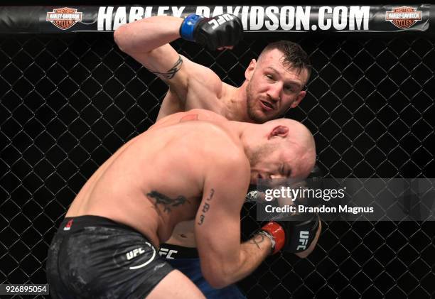 Adam Milstead punches Jordan Johnson in their light heavyweight bout during the UFC 222 event inside T-Mobile Arena on March 3, 2018 in Las Vegas,...