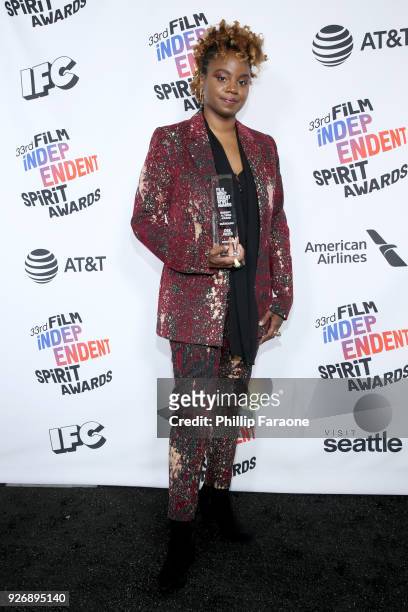 Director Dee Rees, winner of The Robert Altman Award for 'Mudbound', poses in the press room during the 2018 Film Independent Spirit Awards on March...