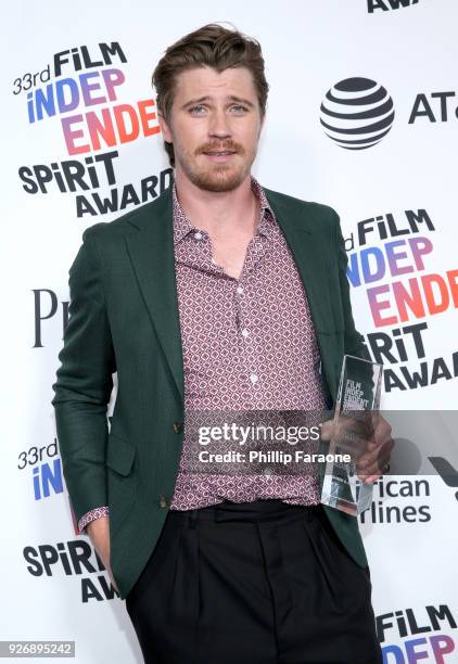 Actor Garrett Hedlund, winner of the Robert Altman Award for 'Mudbound', poses in the press room during the 2018 Film Independent Spirit Awards on...