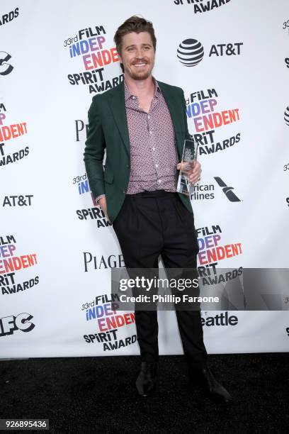 Actor Garrett Hedlund, winner of the Robert Altman Award for 'Mudbound', poses in the press room during the 2018 Film Independent Spirit Awards on...