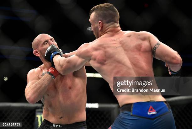 Adam Milstead punches Jordan Johnson in their light heavyweight bout during the UFC 222 event inside T-Mobile Arena on March 3, 2018 in Las Vegas,...