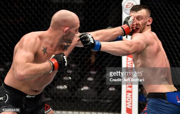 Jordan Johnson punches Adam Milstead in their light heavyweight bout during the UFC 222 event inside T-Mobile Arena on March 3, 2018 in Las Vegas,...