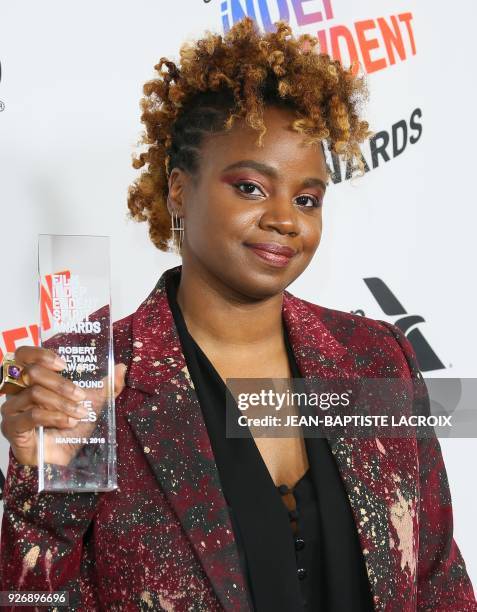 Director Dee Rees, winner of the Robert Altman Award for 'Mudbound', poses in the press room during the 2018 Film Independent Spirit Awards, in Santa...