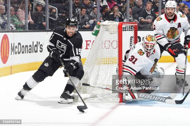 Alex Iafallo of the Los Angeles Kings handles the puck against Anton Forsberg of the Chicago Blackhawks at STAPLES Center on March 3, 2018 in Los...