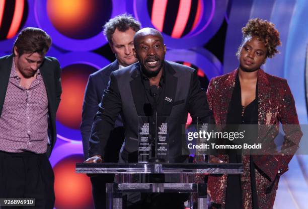 Actors Garrett Hedlund, Jason Clarke and Rob Morgan and writer/director Dee Rees accept the Robert Altman Award for 'Mudbound' onstage during the...