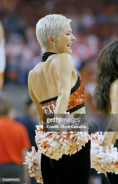 Texas Longhorns cheerleader performs during the game against the Oklahoma State Cowboys at the Frank Erwin Center on February 24, 2018 in Austin,...