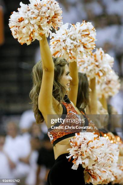 Texas Longhorns cheerleader performs during the game against the Oklahoma State Cowboys at the Frank Erwin Center on February 24, 2018 in Austin,...