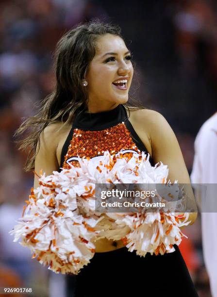 Texas Longhorns cheerleader performs during the game against the Oklahoma State Cowboys at the Frank Erwin Center on February 24, 2018 in Austin,...