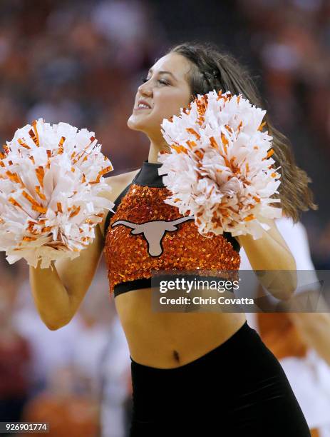 Texas Longhorns cheerleader performs during the game against the Oklahoma State Cowboys at the Frank Erwin Center on February 24, 2018 in Austin,...