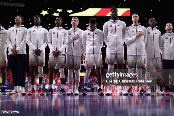 The Arizona Wildcats stand attended for the national anthem before the college basketball game against the California Golden Bears at McKale Center...