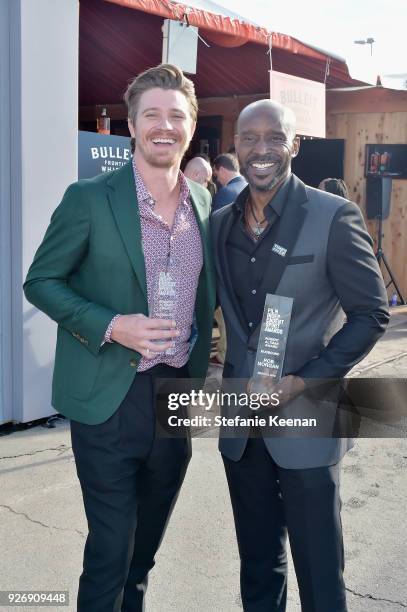 Actors Garrett Hedlund and Rob Morgan, winners of the Robert Altman Award for 'Mudbound,' celebrated with a Bulleit cocktail at the Bulleit Frontier...