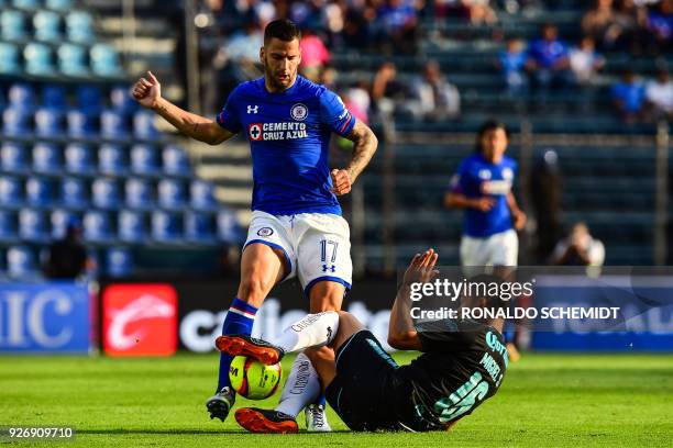 Cruz Azul's Edgar Mendez vies for the ball with Miguel Samudio of Queretaro, during their Mexican Clausura 2018 tournament football match at the Azul...