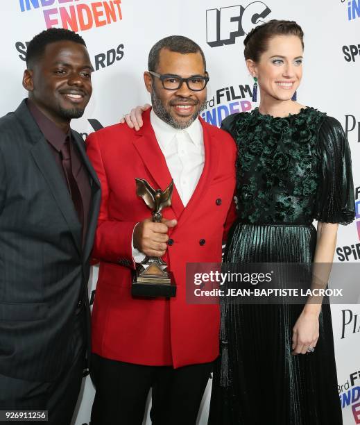 Daniel Kaluuya, Jordan Peele and Allison Williams, with the Best Feature Award for "Get Out." pose in the press room during the 2018 Film Independent...