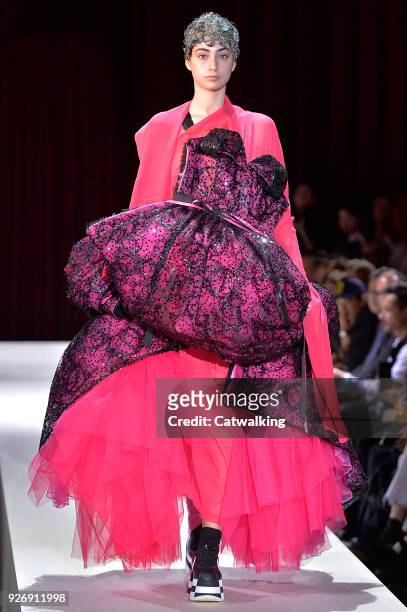 Model walks the runway at the Comme Des Garcons Autumn Winter 2018 fashion show during Paris Fashion Week on March 3, 2018 in Paris, France.