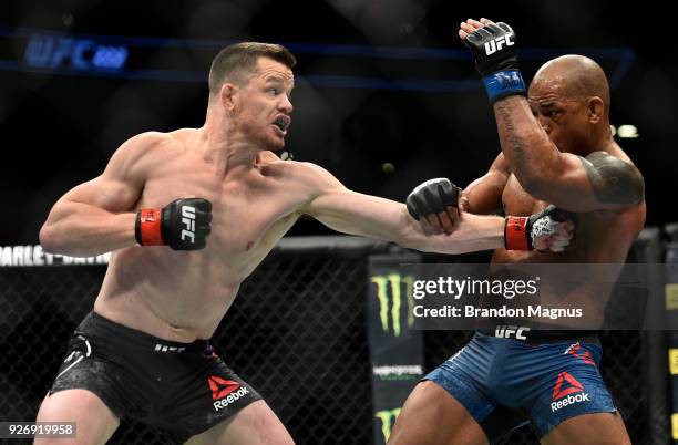 Dollaway punches Hector Lombard of Cuba in their middleweight bout during the UFC 222 event inside T-Mobile Arena on March 3, 2018 in Las Vegas,...