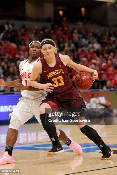 Minnesota Golden Gophers guard Carlie Wagner gets the ball stuck on her hip as she drives past Ohio State Buckeyes guard Linnae Harper during the...