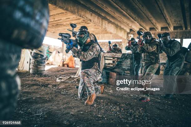 follow me... - woman shooting machine gun stock pictures, royalty-free photos & images