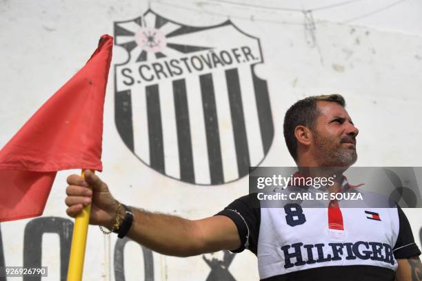 Antonio Carlos Dias, former professional footballer and manager of Sao Cristovao football club, stands on the club's pitch corner in Rio de Janeiro,...