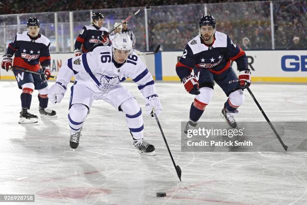 Mitchell Marner of the Toronto Maple Leafs skates past Matt Niskanen of the Washington Capitals during the first period in the Coors Light NHL...