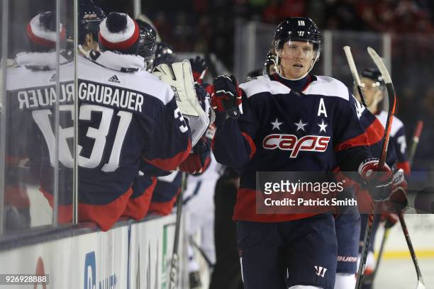Nicklas Backstrom of the Washington Capitals celebrates his goal with teammates against the Toronto Maple Leafs during the first period in the Coors...