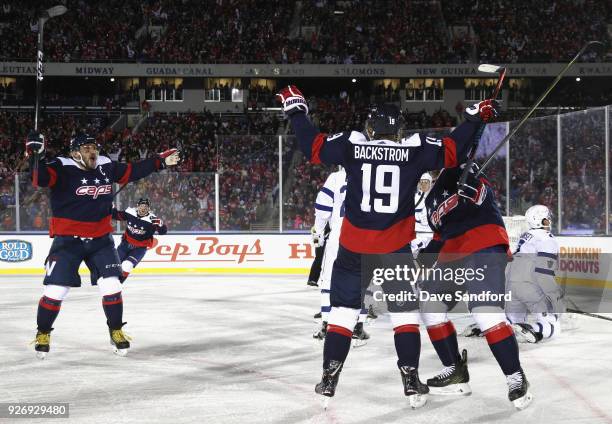 Alex Ovechkin and T.J. Oshie of the Washington Capitals celebrate teammate's Nicklas Backstrom power play goal during the first period of the 2018...