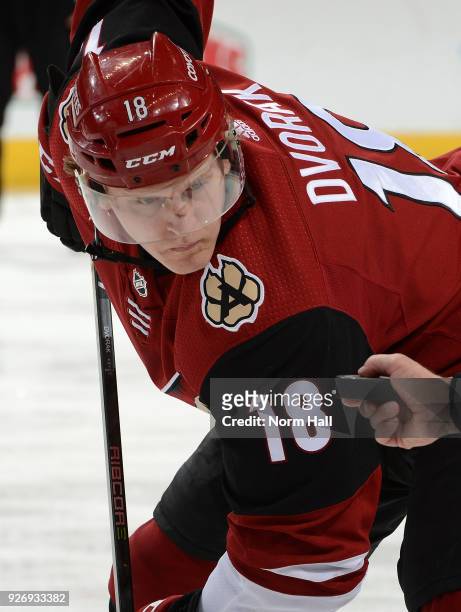 Christian Dvorak of the Arizona Coyotes gets ready to take a faceoff against the Minnesota Wild at Gila River Arena on March 1, 2018 in Glendale,...