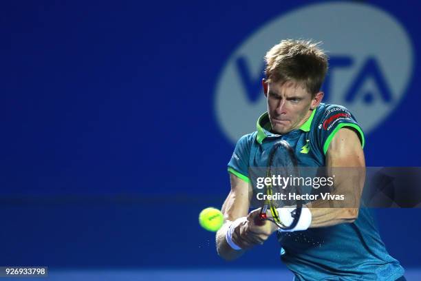 Kevin Anderson of South Africa returns a shot during a semifinal match between Jared Donaldson of United States and Kevin Anderson of South Africa as...